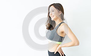 Portrait sport Asian Korean beauty body slim woman in sportswear standing relax and smiling looking up isolated over white wall