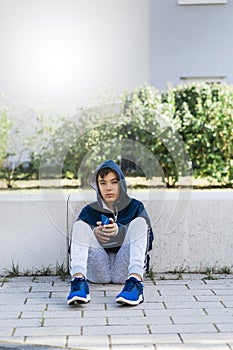 Portrait of Sportive Caucasian male boy Posing in the street