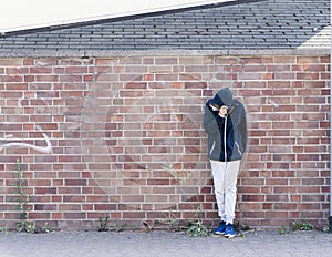 Portrait of Sportive Caucasian male boy Posing in the street