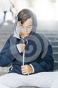 Portrait of Sportive Caucasian male boy Posing in the street