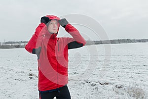 Portrait of sportsman during his winter running training session