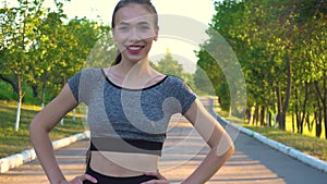 Portrait of sporty athletic woman in sportswear looking in camera.