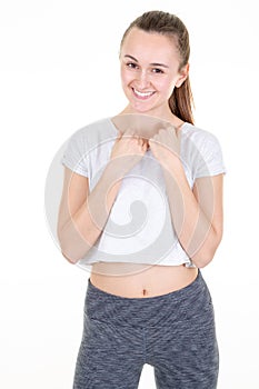 Portrait of sporty beautiful girl posing with fitness clothes in white studio background