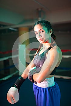 Portrait of sporty boxer girl posing for camera