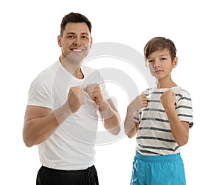 Portrait of sporty dad and his son isolated
