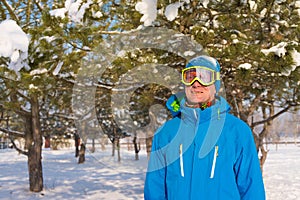 Portrait of sporty man who is wearing winter jacket and ski gogg