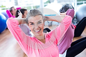 Portrait of sporty woman doing sit ups