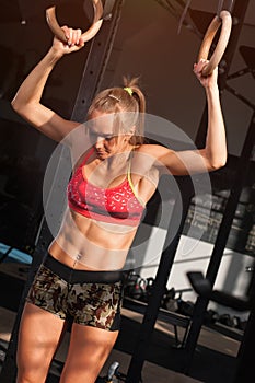 Portrait of Sporty woman showing well trained abdominal muscles