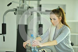 Portrait of sporty young woman training in gym