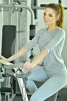 Portrait of sporty young woman training in gym