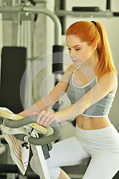 Portrait of sporty young woman training in gym