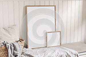 Portrait and square empty wooden frame mockups with straw basket and linen cloth. White beadboard wainscot wall paneling