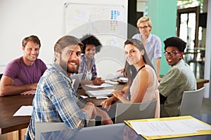 Portrait Of Staff At Brainstorming Meeting In Office