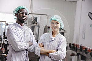Portrait staff worker in food and drink factory industry mix race standing happy smile together