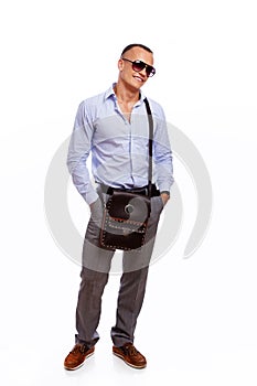 Portrait of handsome man posing in studio on white background wi