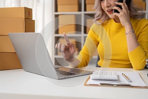 Portrait of Starting small businesses SME owners female entrepreneurs working on receipt box