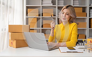 Portrait of Starting small businesses SME owners female entrepreneurs working on receipt box