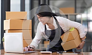 Portrait of Starting small businesses SME owners female entrepreneurs working on receipt box and check online orders to