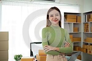 Portrait of Starting small businesses SME owners female entrepreneurs working on receipt box and check online orders to