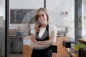 Portrait of Startup successful small business owner in coffee shop.handsome man barista cafe owner. SME entrepreneur seller