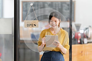 Portrait of Startup successful small business owner in coffee shop. SME entrepreneur seller business concept