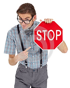 Portrait, stop sign and a man nerd pointing in studio isolated on a white background to direct traffic. Safety, law or