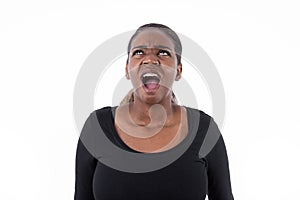 Portrait of stressed African American woman screaming