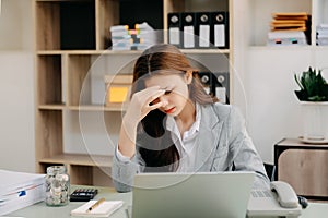 portrait of stressed business woman with social network diagram in the office photo
