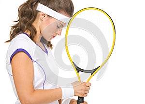 Portrait of stressed female tennis player