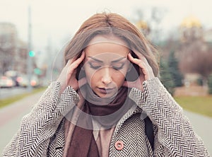 Portrait stressed sad woman outdoors. City urban life style stress