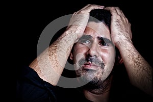 Portrait of a stressed and sad young man