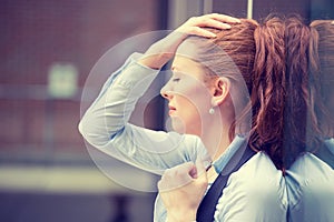 Portrait stressed sad young woman outdoors. Urban life style stress