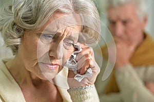 portrait of stressed senior woman crying