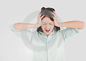 Portrait of stressed tense woman with grey background