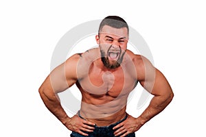 Portrait of a strong bearded male fitness model, torso. White background, isolate. hands on his hips.