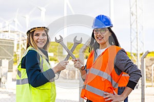 Portrait of strong and confident businesswomen working in electric power station