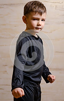 Portrait of Strong Male Kid in Black Attire