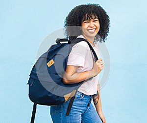 Portrait, student and black woman with backpack on blue background for studying. Happy face, girl and young person with