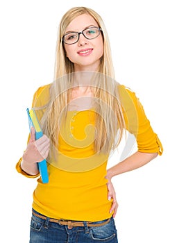 Portrait of student girl in glasses with book