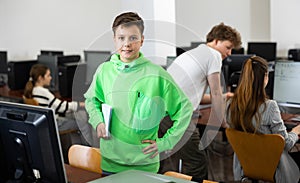 Portrait of a student with a notebook in computer class