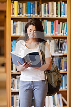 Portrait of a student reading a book