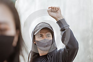 Portrait students with face mask conducting demonstrations