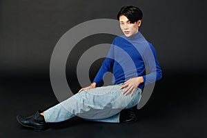 Portrait studio closeup full body shot of Asian young sexy luxury glamour slim fashionable LGBTQ gay male model in turtleneck long
