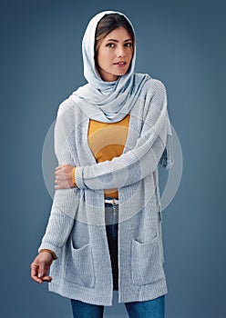 Portrait, studio and fashion with arab woman, clothes for Ramadan with modesty for religion and faith. Eco friendly