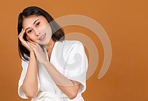 Portrait studio shot of millennial young Asian short black hair female model in white shower rope standing smiling look at camera