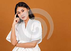 Portrait studio shot of millennial young Asian short black hair female model in white shower rope standing smiling look at camera