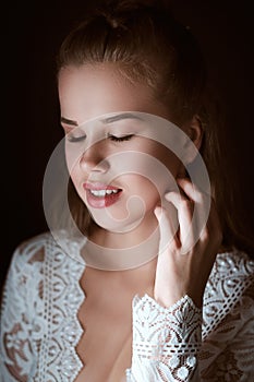 Portrait of Stunning young fashionable bride holding bouquet