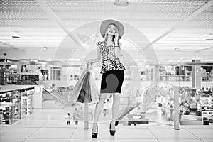 Portrait of a stunning young woman with shopping bags in mall