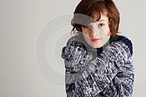 Portrait, style and boy child in a studio with winter, casual and stylish outfit with positive attitude. Youth, clothes