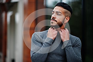 Portrait of stylish arab beard man wear grey turtleneck. Arabian model guy